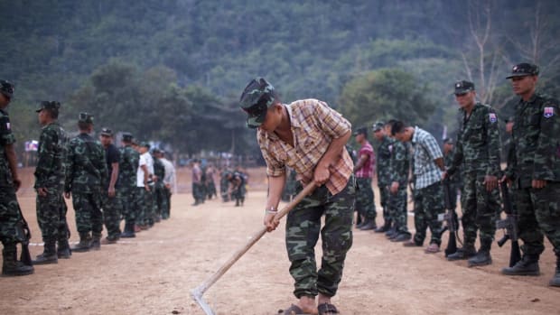 A Karen National Liberation Army soldier preparing the ground ahead of celebrations marking the 66th Karen Revolution Day in Myanmar's eastern Karen state in January of 2015.