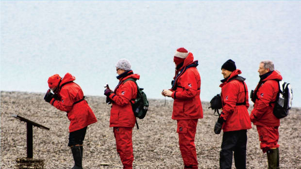 Lining up for a plaque on Beechey Island in the Canadian Arctic Archipelago of Nunavut, Canada.