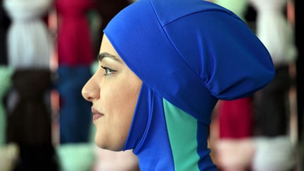 Profile photo of the head of a woman wearing a burkini swimsuit