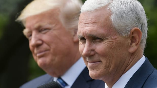 Vice President Mike Pence speaks while standing next to President Donald Trump during a ceremony before the signing of an executive order on promoting free speech and religious liberty in the Rose Garden of the White House on May 4th, 2017.