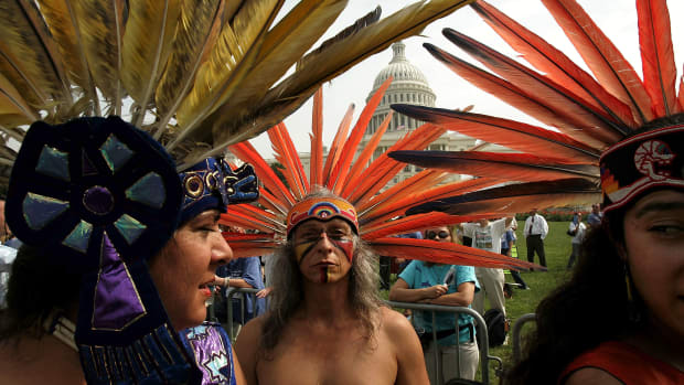 A member of an indigenous tribe in Mexico prepares to perform a traditional dance outside the U.S. Capitol with several hundred other protesters on hand to urge Congress to keep the Arctic National Wildlife Refuge off-limits to oil drilling.