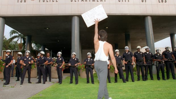 A demonstrator protests the verdict in the trial of four Los Angeles police officers accused of beating motorist Rodney King outside the Los Angeles Police Department headquarters in Los Angeles on April 29th, 1992.