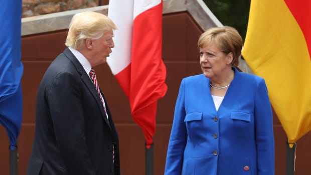 German Chancellor Angela Merkel and President Donald Trump arrive for the group photo at the G7 Taormina summit on the island of Sicily on May 26th, 2017.