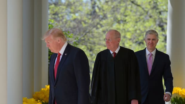 President Donald Trump, Justice Anthony Kennedy, and Neil Gorsuch make their way to the Rose Garden for Gorsuch's swearing-in ceremony as an associate justice of the U.S. Supreme Court at the White House on April 10th, 2017.