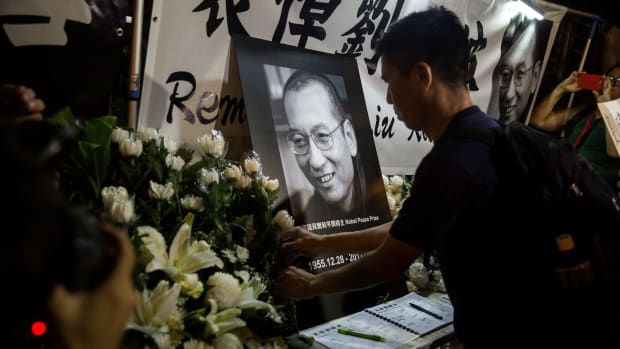 Protesters pay their respects outside the Chinese Liason Office of Hong Kong after the death of Chinese Noble laureate Liu Xiaobo, in Hong Kong on July 13th, 2017. The United States called on China to free the dissident's widow from house arrest and let her leave the country.