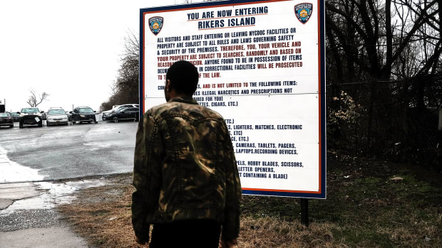 A man enters the road to Rikers Island on March 31st, 2017, in New York City.