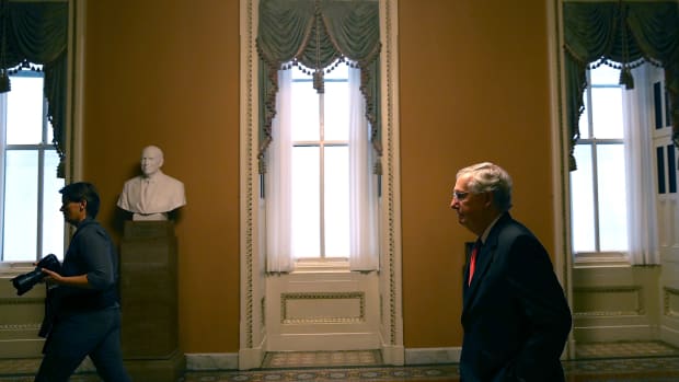 Senate Majority Leader Mitch McConnell walks to his office on July 26th, 2017, in Washington, D.C.
