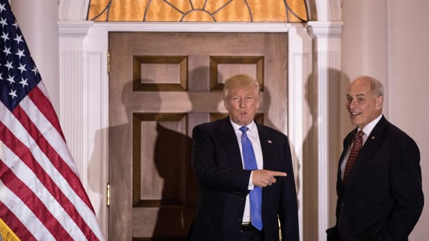 Donald Trump points at U.S. Marine Corps General John Kelly before their meeting at Trump International Golf Club on November 20th, 2016.