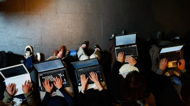Reporters work on their laptops in Beaverton, Oregon.