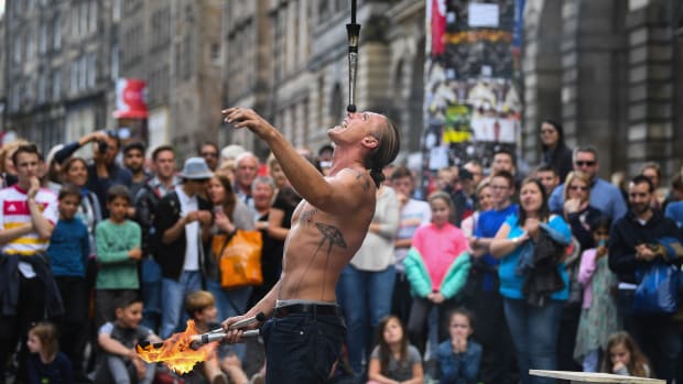 Edinburgh Festival Fringe entertainers perform on the Royal Mile on August 7th, 2017, in Edinburgh, Scotland. This year marks the 70th anniversary of the largest performing arts festival in the world, with an excess of 30,000 performances of more than 2,000 shows.