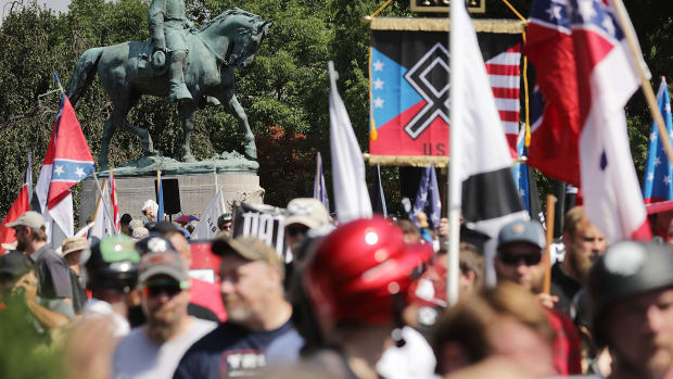 The statue of Robert E. Lee stands behind a crowd of hundreds of white nationalists, neo-Nazis, and members of the alt-right on August 12th, 2017, in Charlottesville, Virginia.