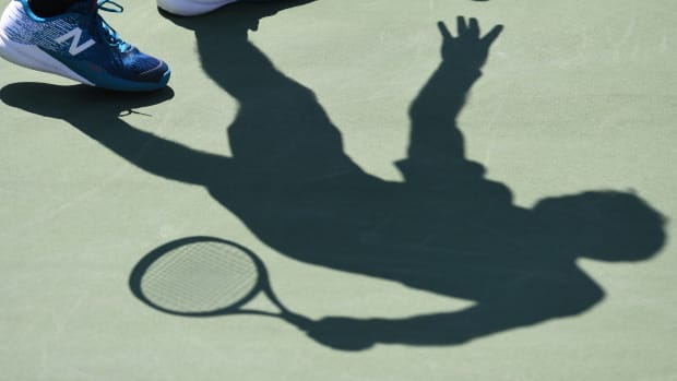 The shadow of France's Jeremy Chardy is seen against France's Gael Monfils during their Qualifying Men's Singles match at the 2017 U.S. Open Tennis Tournament on August 29th, 2017, in New York.