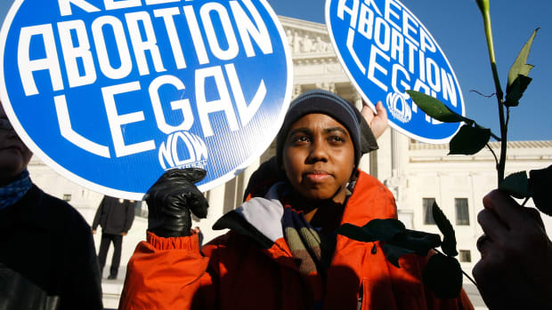 Pro-choice activists holds a sign in front of the U.S. Supreme Court on January 22nd, 2009, in Washington, D.C.