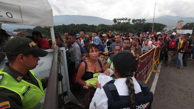 Venezuelan citizens cross the Simon Bolivar international bridge from San Antonio del Tachira in Venezuela to Norte de Santander province of Colombia on February 10th, 2018.