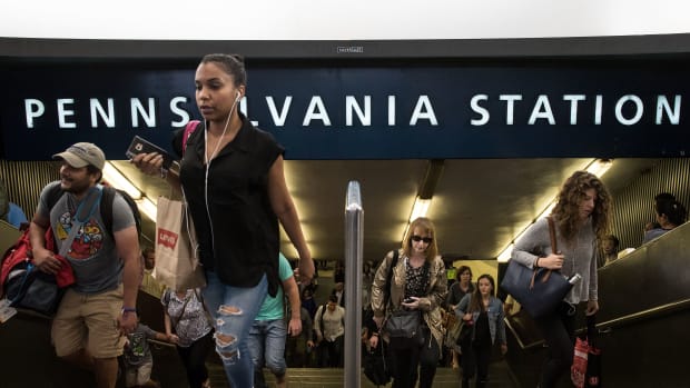 Commuters exit Penn Station during the morning rush hour on July 7th, 2017, in New York City.