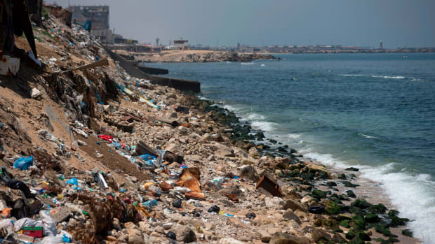 A general view taken on July 2nd, 2017, shows rubbish strewn along the coastline in Gaza City.