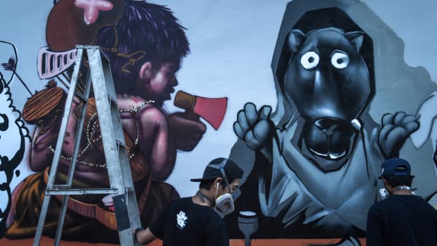 Graffiti artists depict construction tycoon Premchai Karnasuta (left) next to a black panther in Bangkok, Thailand, on March 16th, 2018. This is the latest subversive depiction of an animal that has come to symbolize wild cat-poaching injustice.