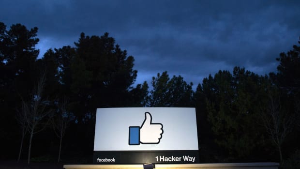 A lit sign at the entrance to Facebook's corporate headquarters in Menlo Park, California.