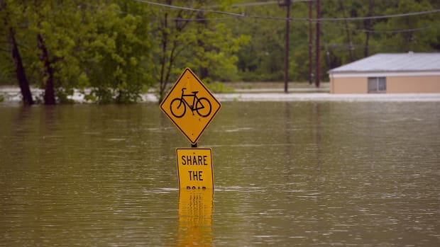 Floodwater covers a street sign on May 4th, 2017, in Fenton, Missouri.