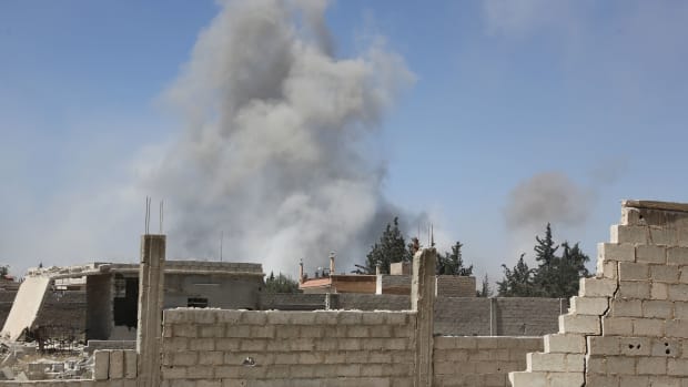 Smoke billows in the town of Douma on April 7th, 2018, after Syrian regime troops resumed a military blitz to pressure rebels to withdraw.