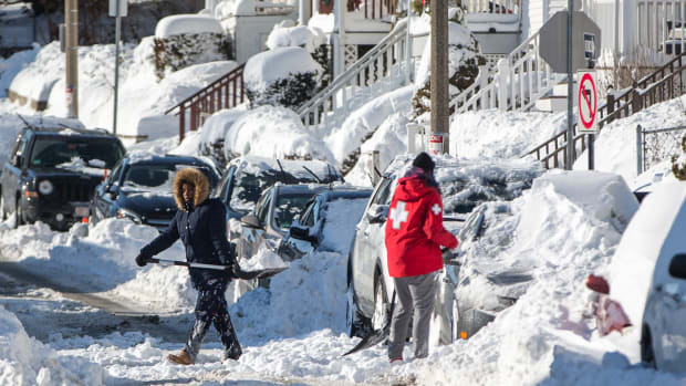 Residents shovel out vehicles the day after a snowstorm, on January 5th, 2018, in Boston, Massachusetts.