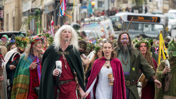 The May Day "King" and "Queen" lead the Greenmen of Glastonbury carrying this year's Maypole through the center of Glastonbury, to a ceremony at Bushy Combe below Glastonbury Tor as part of the town's Beltane May Day celebrations on May 1st, 2018, in Somerset, England. Although more synonymous with International Workers' Day, or Labor Day, May Day or Beltane is celebrated by druids and pagans as the beginning of summer and the chance to celebrate the coming of the season of warmth and light.