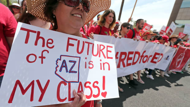 Arizona teachers march toward the State Capitol in Phoenix, Arizona, on April 26th, 2018.