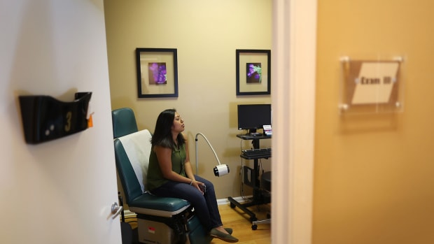 Natalia Reyes sits in the exam room as she gets a health care checkup at a Planned Parenthood health center on June 23, 2017 in West Palm Beach, Florida.