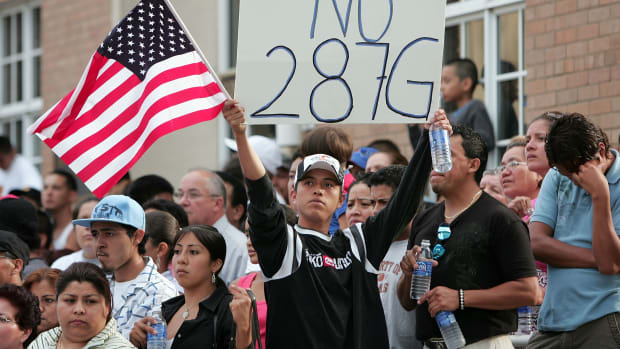 Demonstrators opposing proposition 287(g) gather on July 16th, 2007, in Waukegan, Illinois.