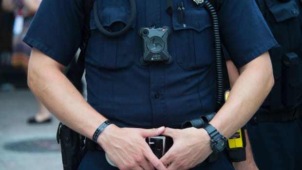 A police officer wears a body camera during an anti-Donald Trump protest in Cleveland