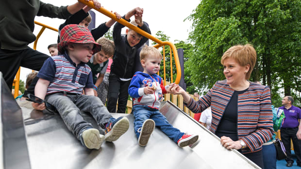 First Minister Nicola Sturgeon holds the hand of two-year-old Jamie McGuiness as she officially opens Play as One Scotland's fully inclusive play park on June 4th, 2018, in Dunfermline, Scotland. The play park has been specially designed for both non-disabled children and children with physical and learning difficulties and is the largest of its kind in Scotland.
