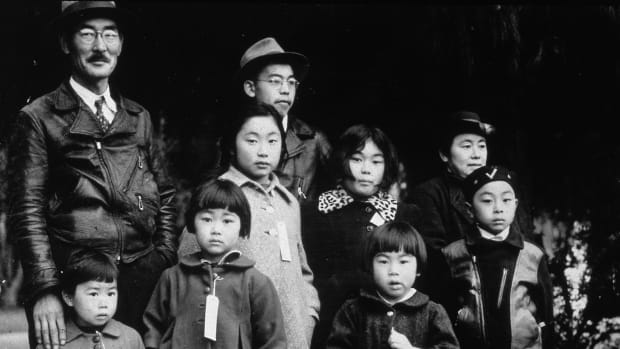 Members of the Japanese-American Mochida family awaiting re-location to a camp, Hayward, California.