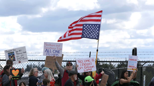 Protesters march outside a federal detention center holding migrant women on June 9th, 2018 in SeaTac, Washington.