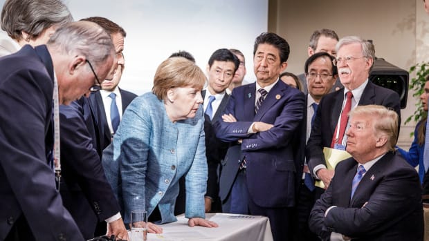 German Chancellor Angela Merkel speaks with President Donald Trump on the second day of the G7 summit on June 9th, 2018, in Charlevoix, Canada.
