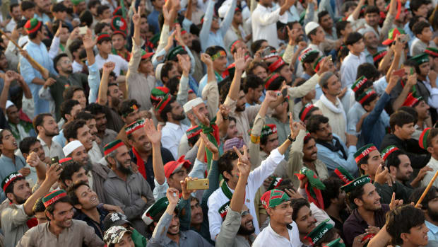 Supporters of Pakistani cricketer-turned-politician and head of the Pakistan Tehreek-i-Insaf (PTI) Imran Khan attend an election campaign rally in Charsadda district, in the Khyber Pakhtunkhwa province, on July 5th, 2018. Pakistan will hold a general election on July 25th, 2018.