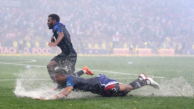Presnel Kimpembe and Thomas Lemar of France celebrate in the rain after victory in the 2018 FIFA World Cup final between France and Croatia at Luzhniki Stadium on July 15th, 2018, in Moscow, Russia.