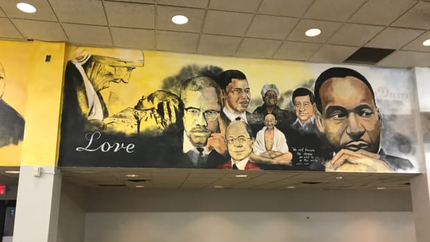 The dining hall walls at Paul Quinn College are painted with murals depicting famous African Americans and other heroes.