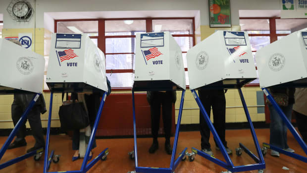 Voters cast their ballots at voting booths on November 8th, 2016, in New York City.