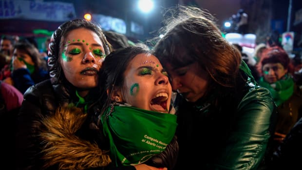 Abortion rights activists comfort each other outside the National Congress in Buenos Aires, Argentina, on August 9th, 2018, after senators rejected a bill that would have legalized abortion. Argentine senators voted against the bill on Thursday, dashing the hopes of women's rights groups after the bill was approved by Congress' lower house in June.