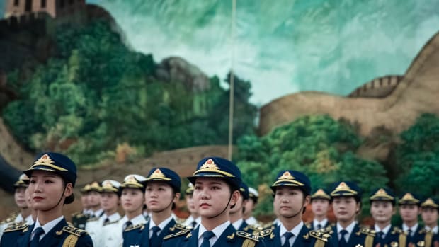 Female members of the Chinese People's Liberation Army honor guard wait to greet Sierra Leone President Julius Maada Bio during a welcome ceremony in the Great Hall of the People on August 30th, 2018, in Beijing, China. Maada Bio is in China for the "Forum on China-Africa Cooperation," which will be held from September 3rd to 4th in Beijing.