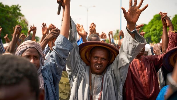 Fulani people protest during a silent march in response to a massacre in Koumaga, Mali.