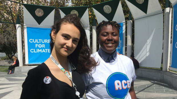 Jamie Margolin (left) with Vic Barrett, a fellow plaintiff suing the government over climate change, outside the Global Climate Action Summit in San Francisco this week.