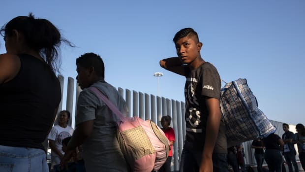 Asylum seekers gather at El Chaparral port of entry in Tijuana, Mexico, on August 10th, 2018, as they look for an appointment to present their asylum request before the United States authorities.