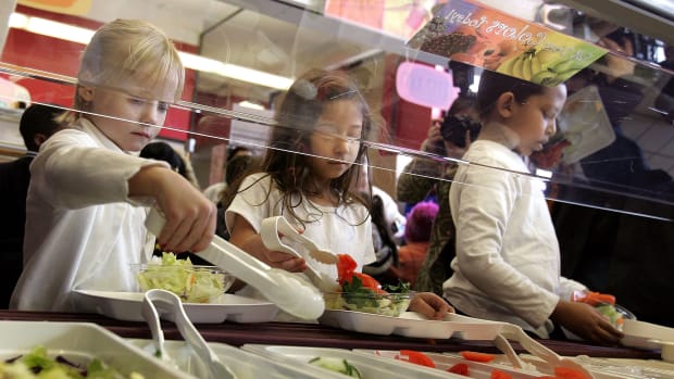 Students at Nettelhorst Elementary School dig into a salad bar in the school's lunchroom on March 20th, 2006, in Chicago, Illinois.