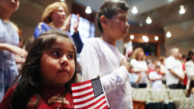 New U.S. citizen Davies Garcia, 11, originally from Mexico, stands with his sister, Valerie, during a naturalization ceremony conducted by U.S. Citizenship and Immigration Services on September 14th, 2018, in Los Angeles, California.