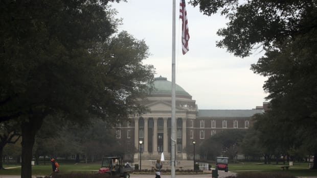 A student walks in front of Dallas Hall on the Southern Methodist University campus in Dallas, Texas.