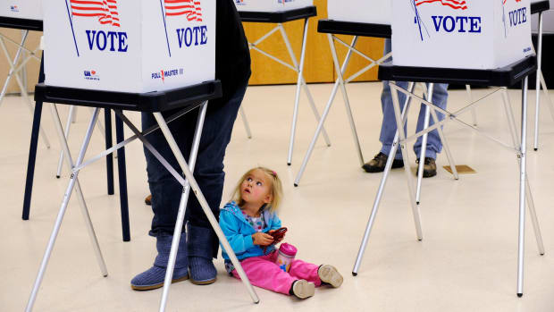 Allyson Webb watches her mother, Angela Webb vote at the Gilpin County Community Center on November 2nd, 2010, outside of Central City, Colorado.