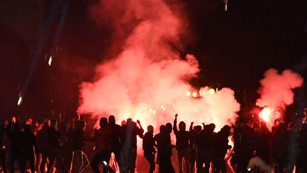 Tear gas envelops Marseille football supporters during clashes with French security officials on a street in Marseille, France, on October 25th, 2018, ahead of a match with Italian club Lazio. The two teams, both known for some of the most intense fans in football, played a Union of European Football Associations Europa League match in the Mediterranean city. Fans set off flares in the street; police responded in full riot gear with pepper spray and tear gas.