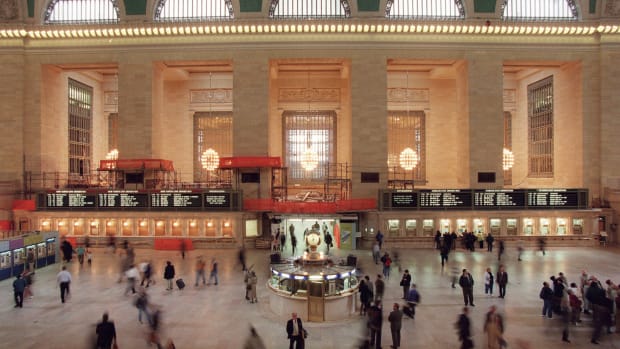 Commuters and train passengers walk through the main concourse of of Grand Central Station.
