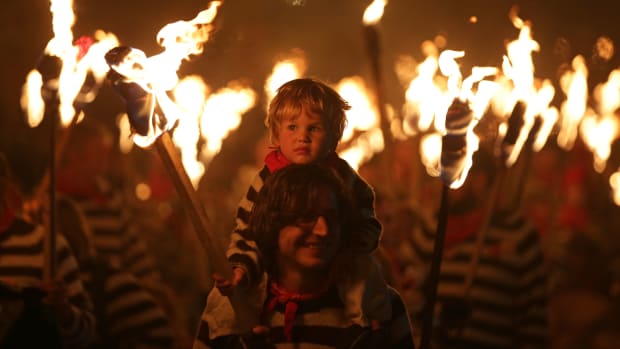 Revelers parade through the streets of Lewes in East Sussex, southern England, on November 5th, 2018, during traditional Bonfire Night celebrations. Thousands of people attended the annual parade through the narrow streets until the evening came to an end with the burning of an effigy or "guy," usually representing Guy Fawkes, who died in 1605 after an unsuccessful attempt to blow up the Houses of Parliament.